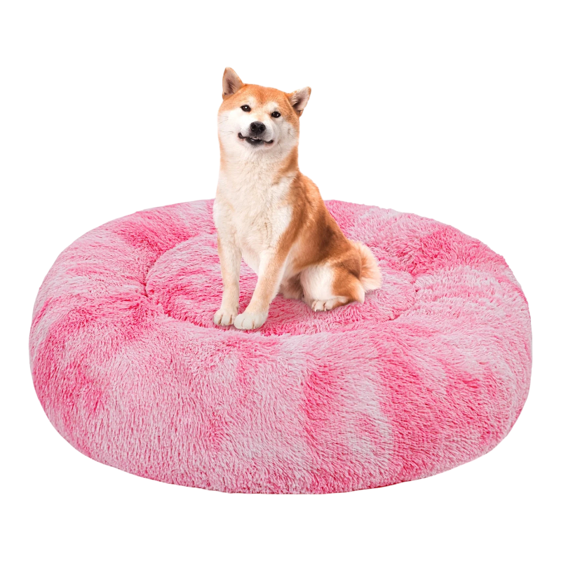 Shiba Inu sitting on round pink faux fur anti-anxiety plush pet bed for small to medium dogs